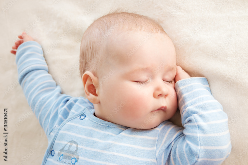 Baby sleeping covered with soft blanket