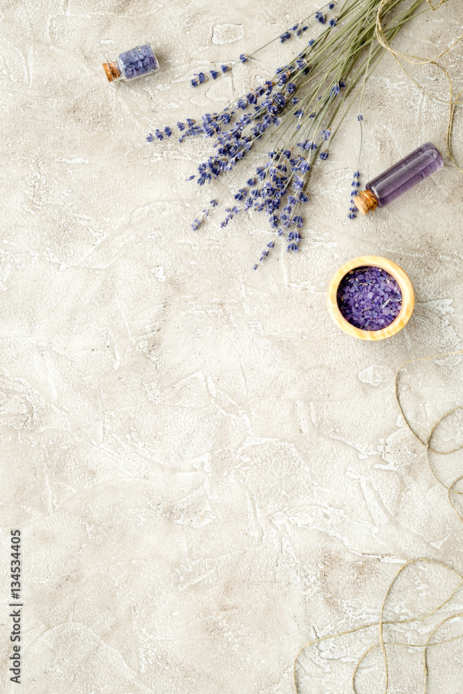 Essential oil and lavender salt with flowers top view