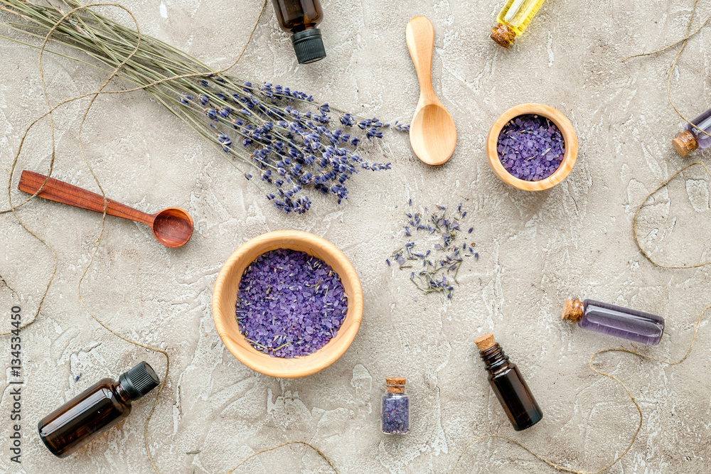 Essential oil and lavender salt with flowers top view