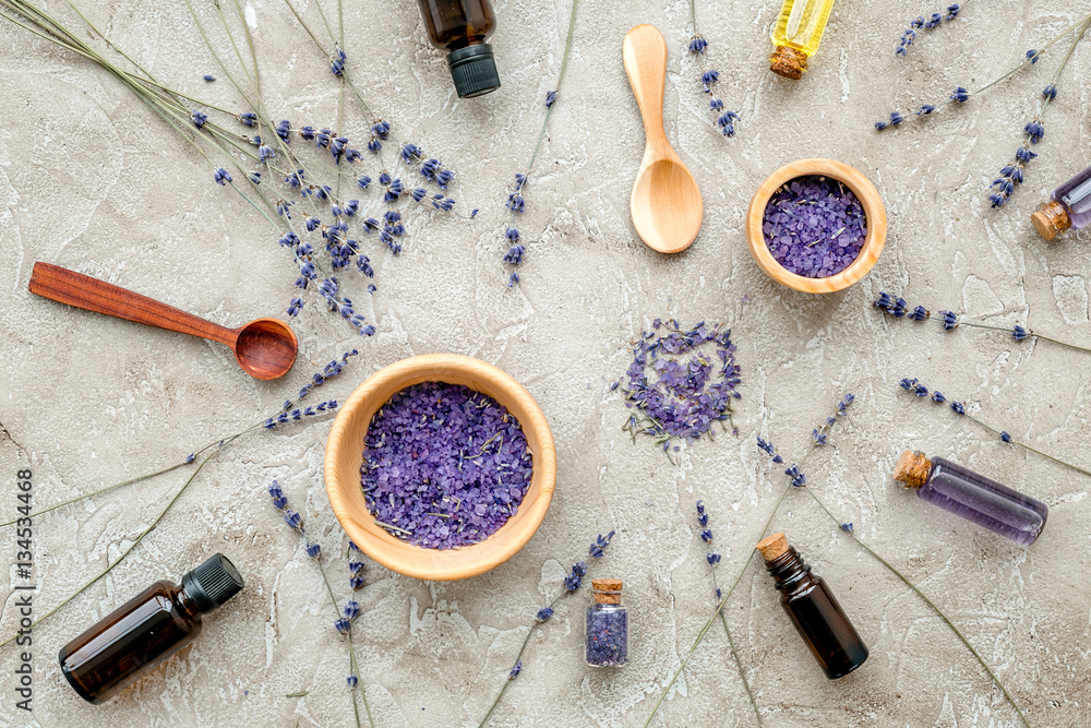 Essential oil and lavender salt with flowers top view