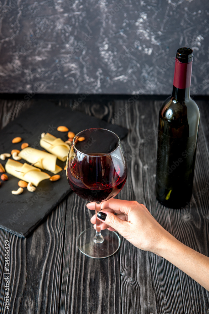 red wine with cheese on wooden background top view