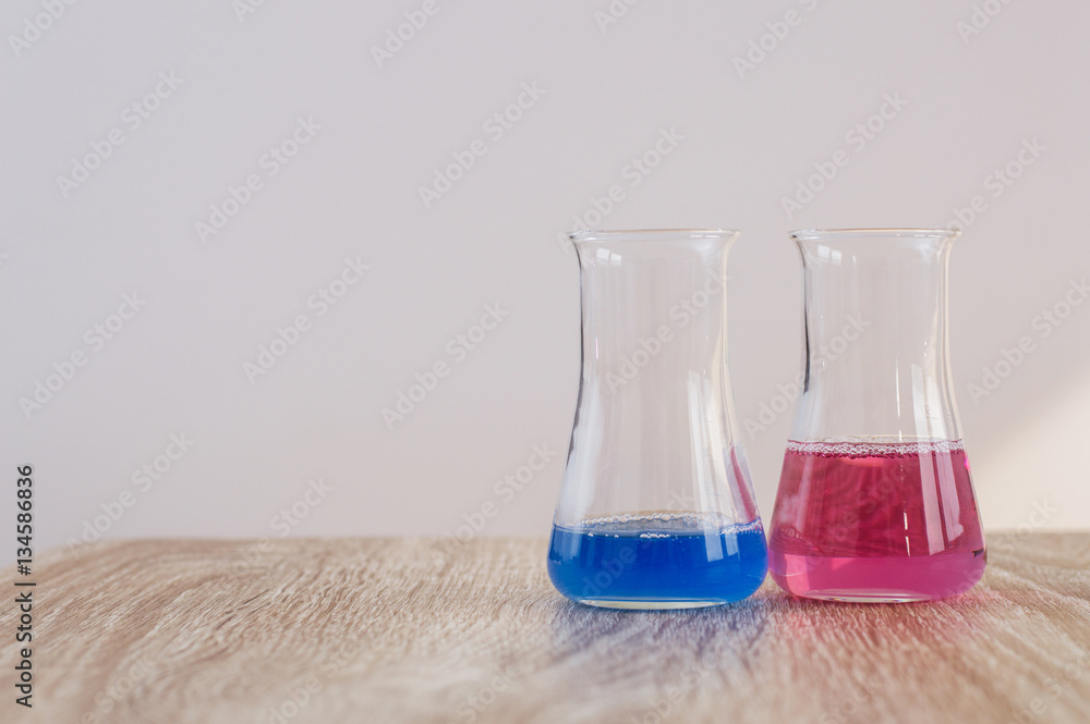 Laboratory glassware with liquids of different colors