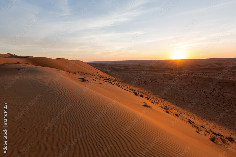 Sunset in the sand desert of Oman