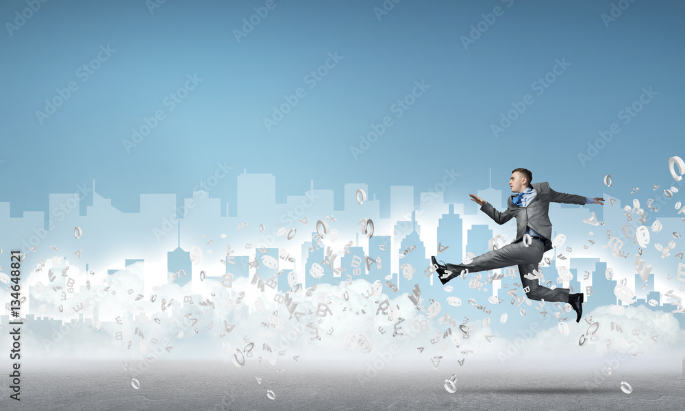 Businessman jumping high