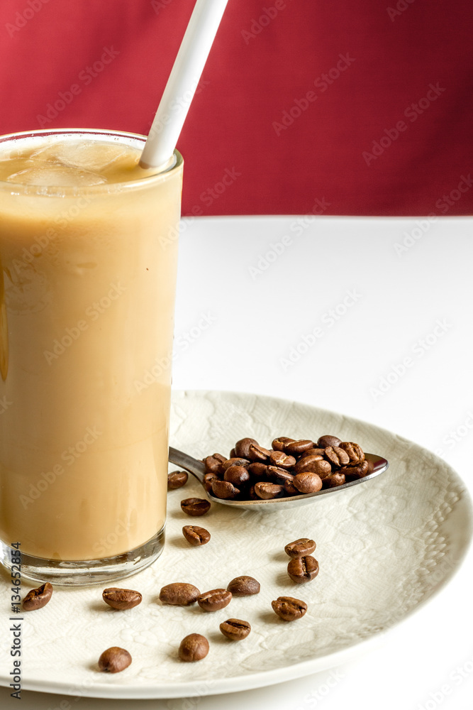 coffee with ice in glass on white background