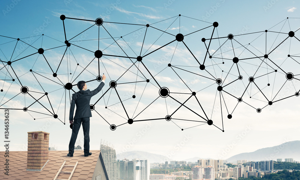 Businessman on house roof presenting networking and connection c