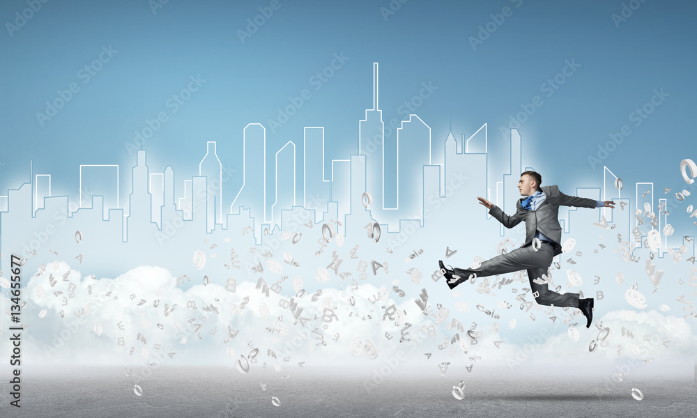 Businessman jumping high