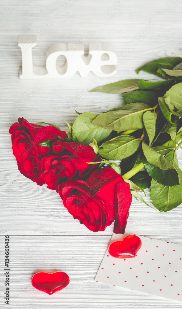 concept Valentines Day with flower wooden background top view