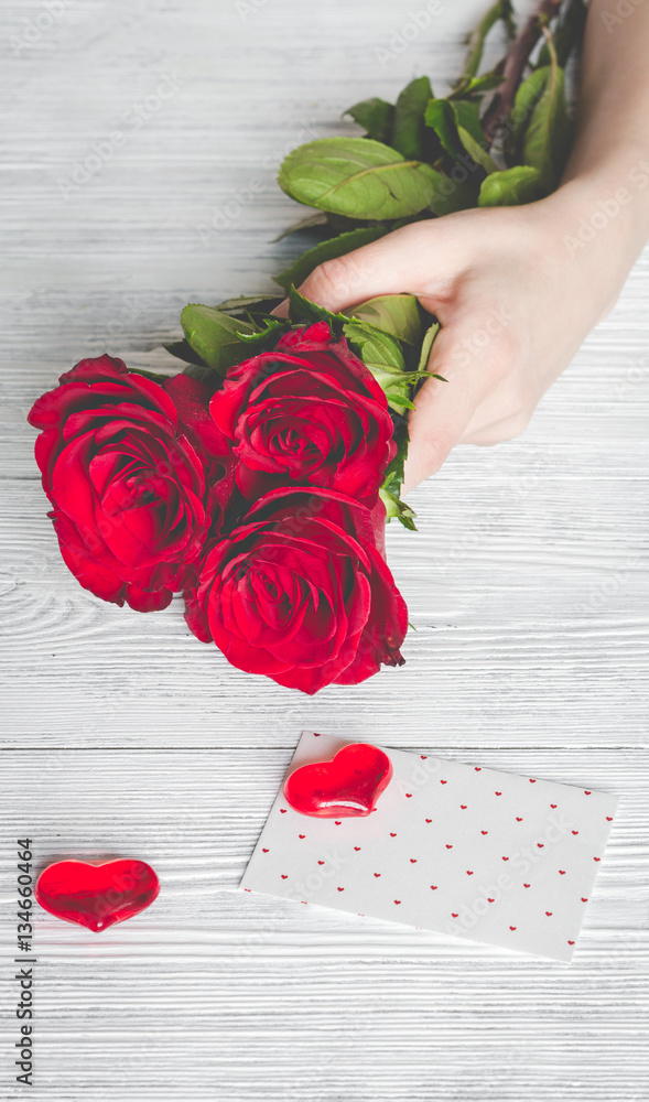 concept Valentines Day with flower wooden background top view