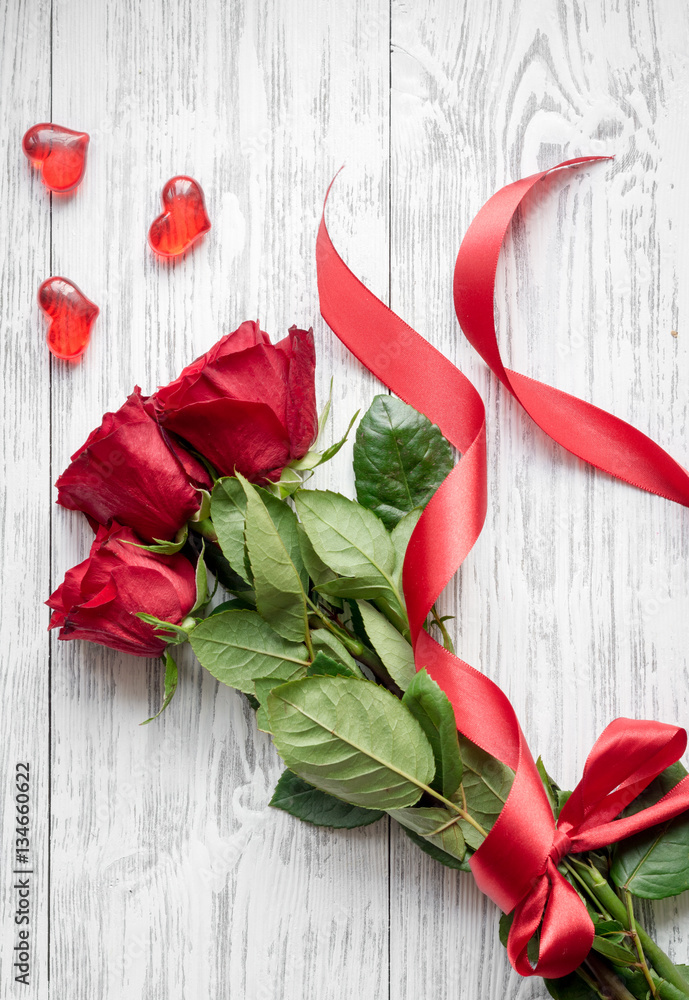 concept Valentines Day with flower wooden background top view