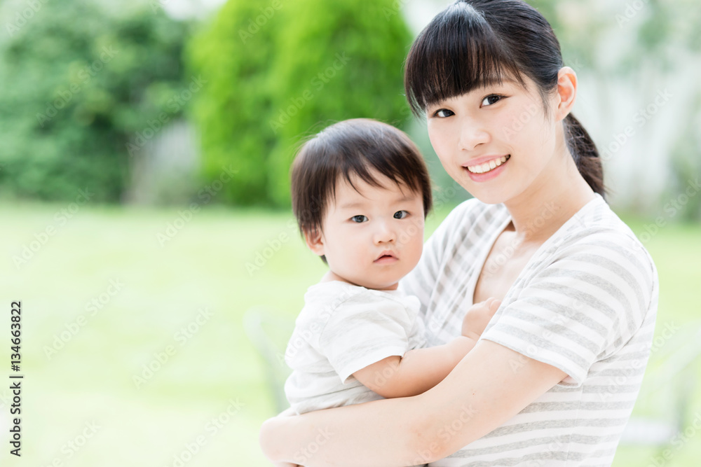 portrait of asian mother and baby in the park