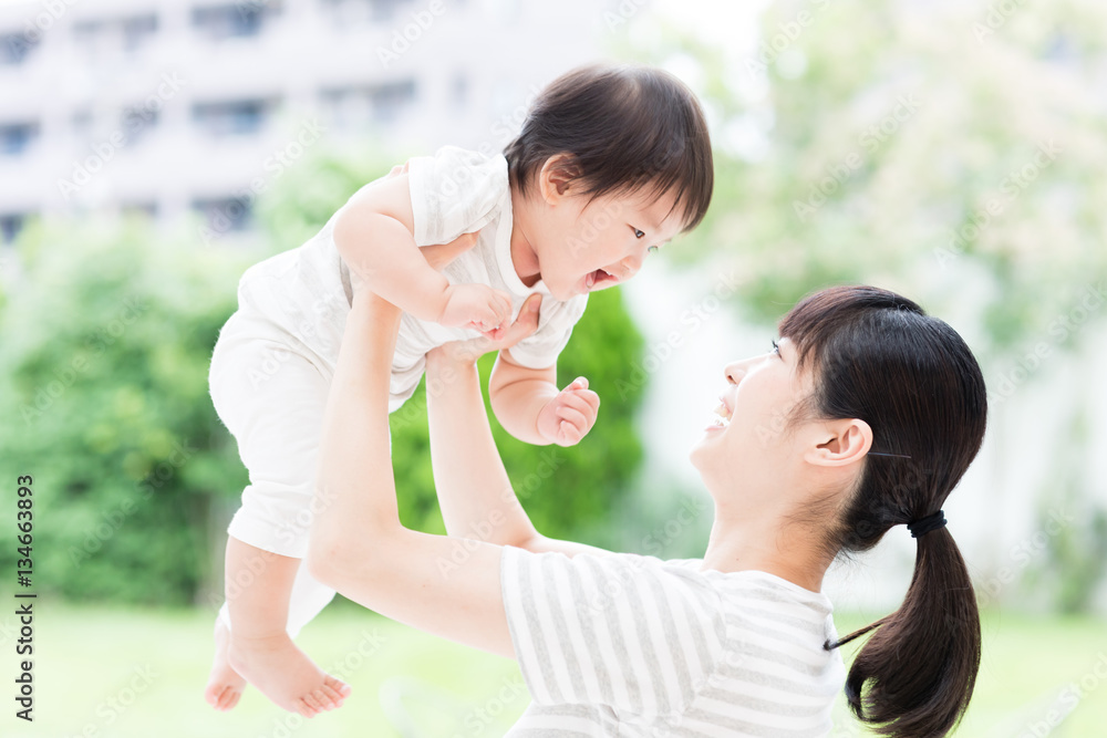 portrait of asian mother and baby in the park