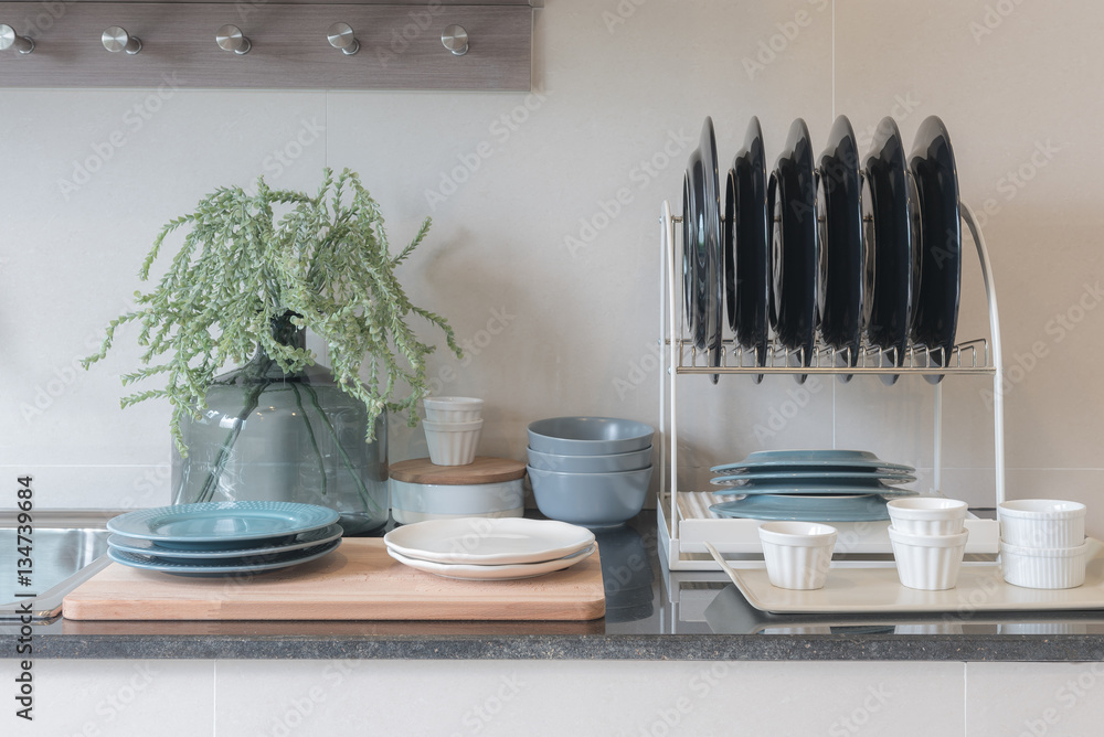 modern kitchen room with sink on top granite counter