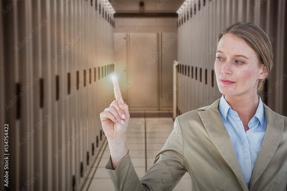 Composite image of businesswoman pointing with her finger 