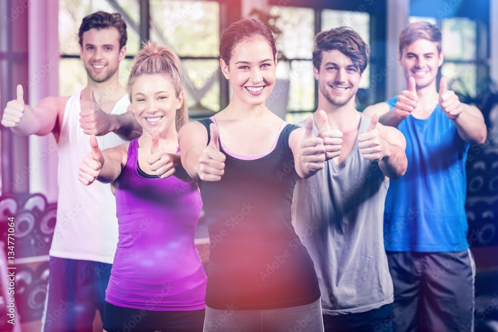 Fitness class showing thumbs up