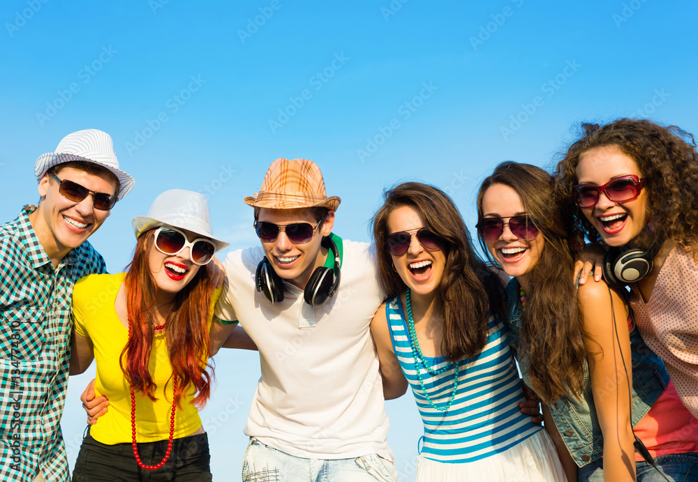 group of young people wearing sunglasses and hat