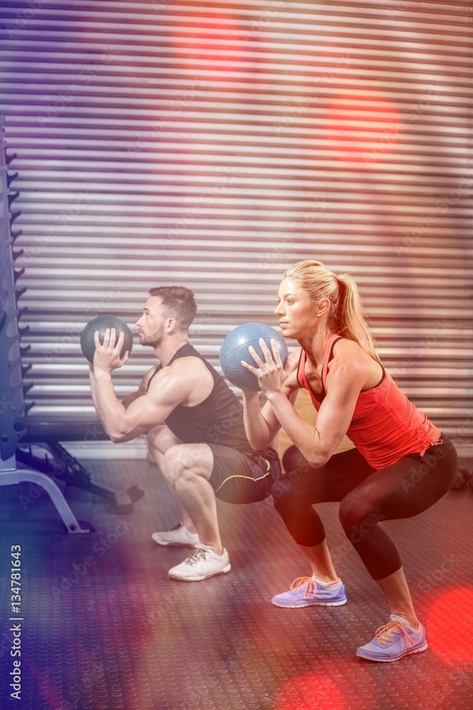 Couple doing ball exercise