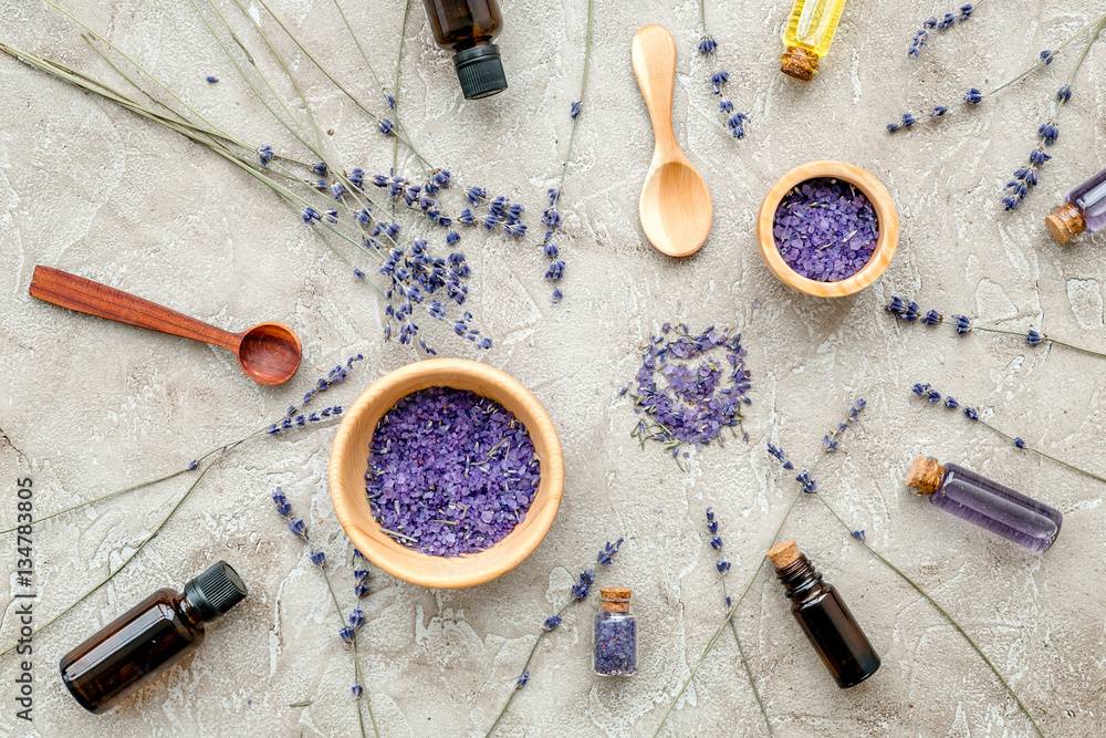 Essential oil and lavender salt with flowers top view