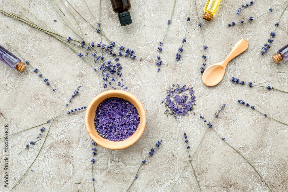 Essential oil and lavender salt with flowers top view