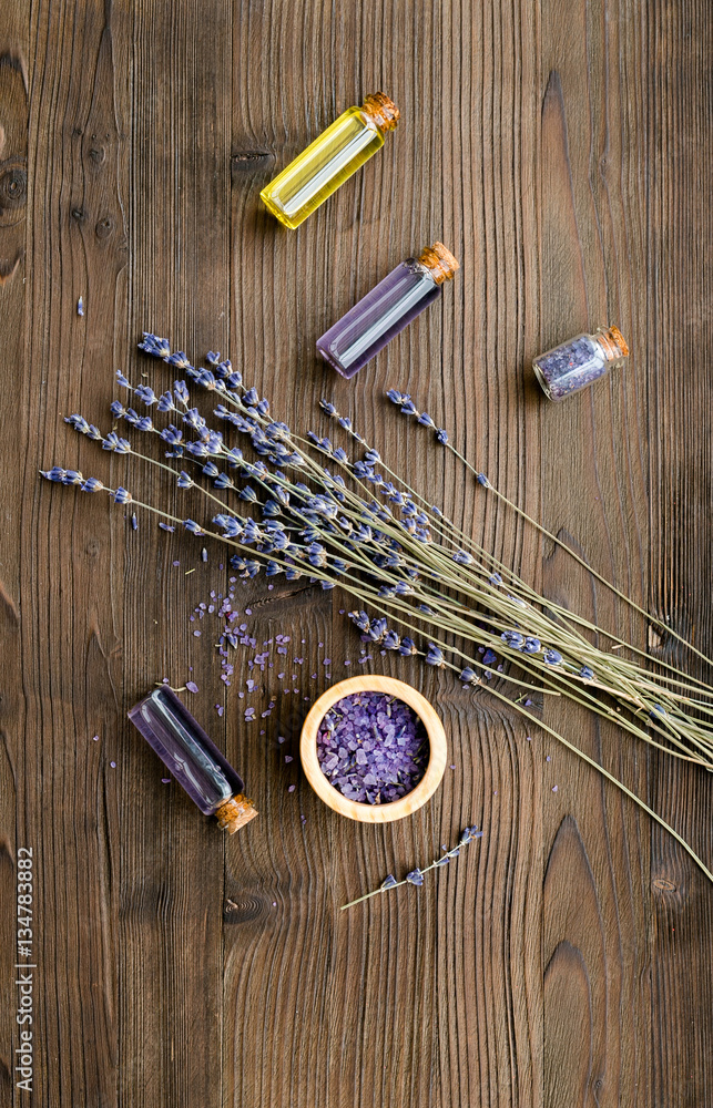 organic cosmetics with lavender on wooden background top view