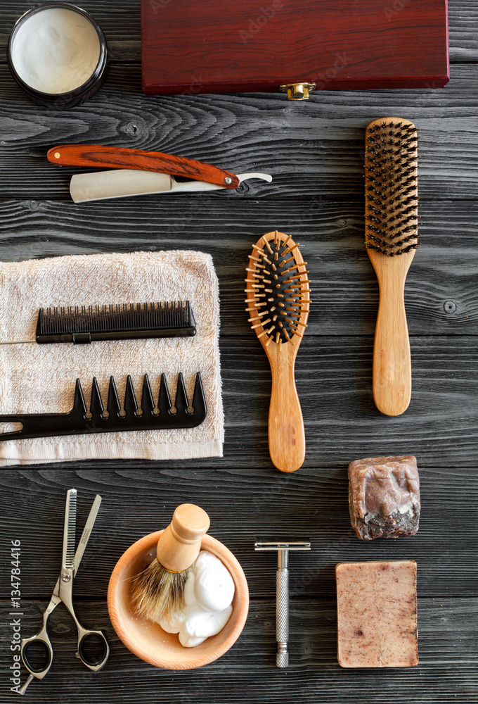 Tools for cutting beard barbershop top view on wooden background