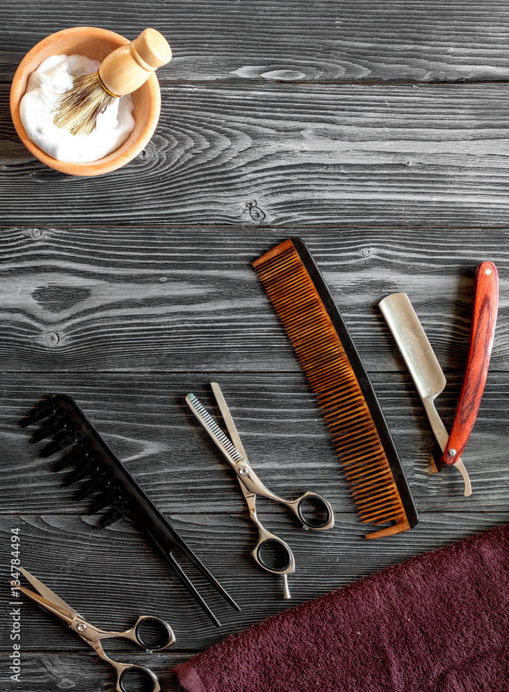 Tools for cutting beard barbershop top view on wooden background