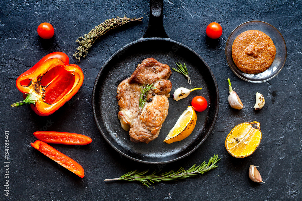 concept cooked steak on dark background top view