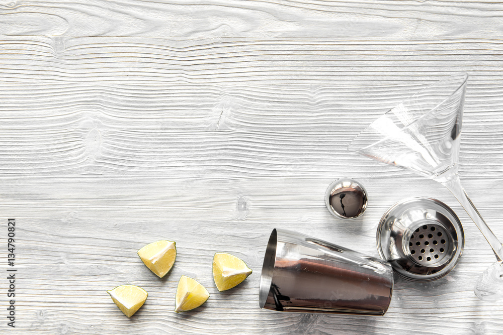 martini and shaker top view of wooden background