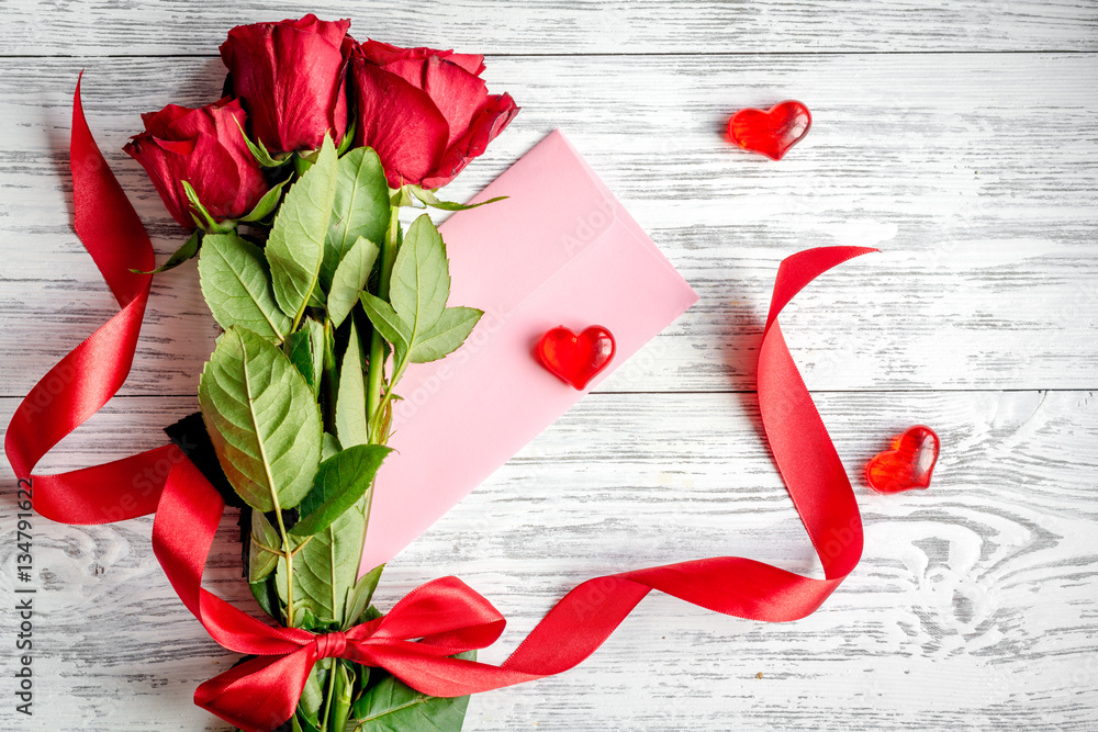 concept Valentines Day with flower wooden background top view