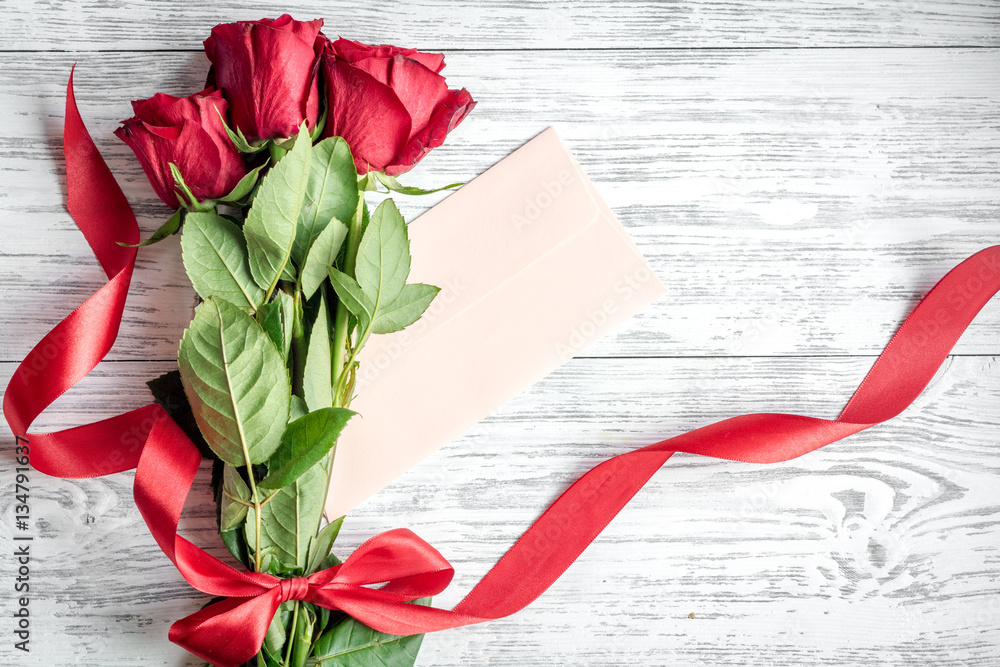 concept Valentines Day with flower wooden background top view