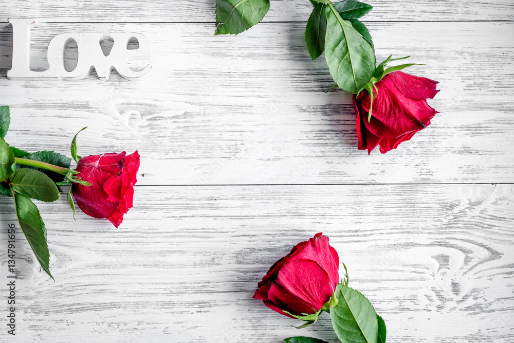 concept Valentines Day with flower wooden background top view