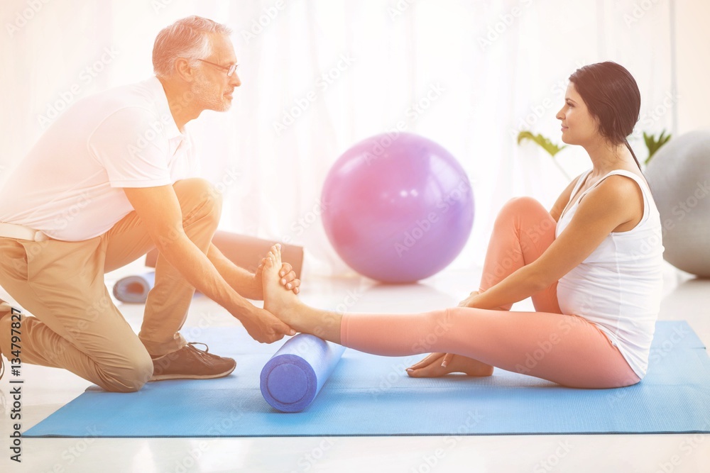 Physiotherapist giving physiotherapy to pregnant lady