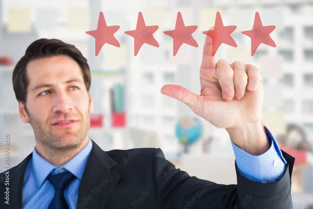 Composite image of confident businessman pointing at something