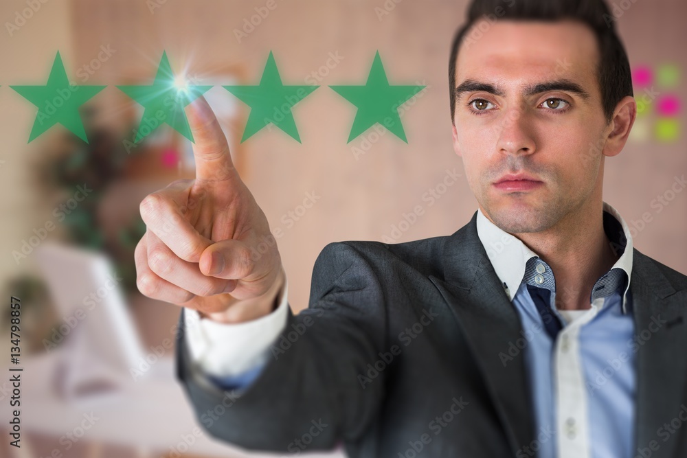 Composite image of handsome young businessman pointing