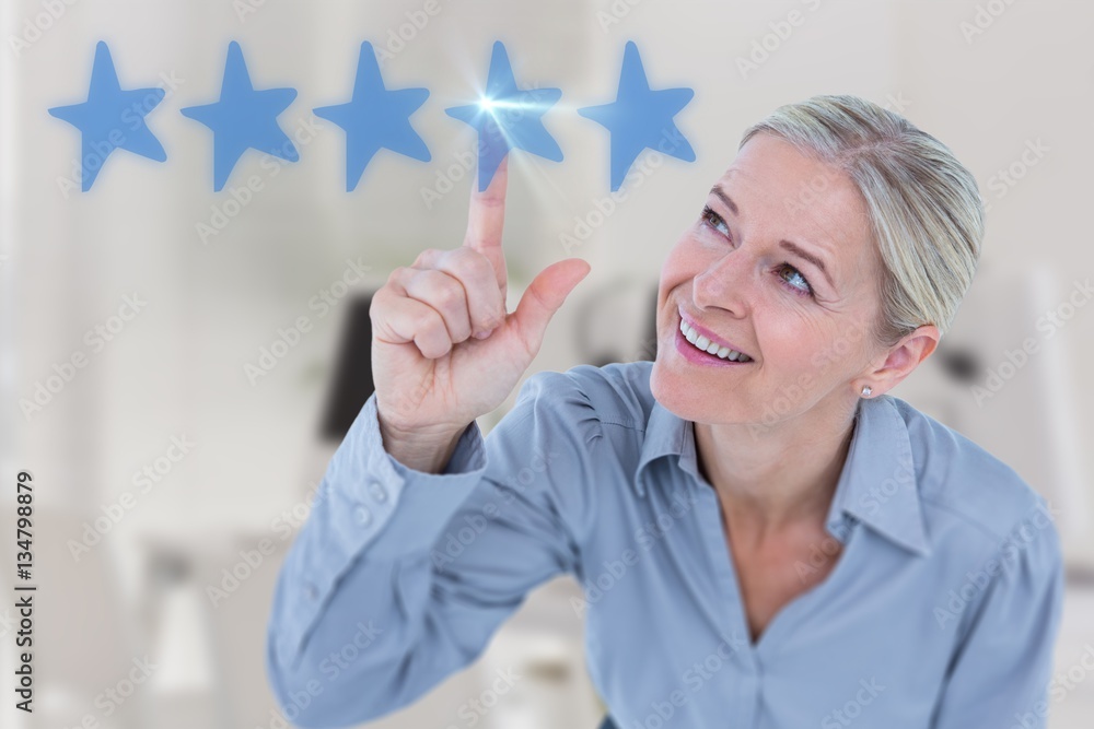 Composite image of smiling businesswoman pointing