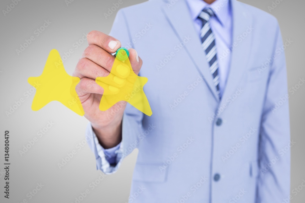 Composite image of midsection of businessman writing with marker