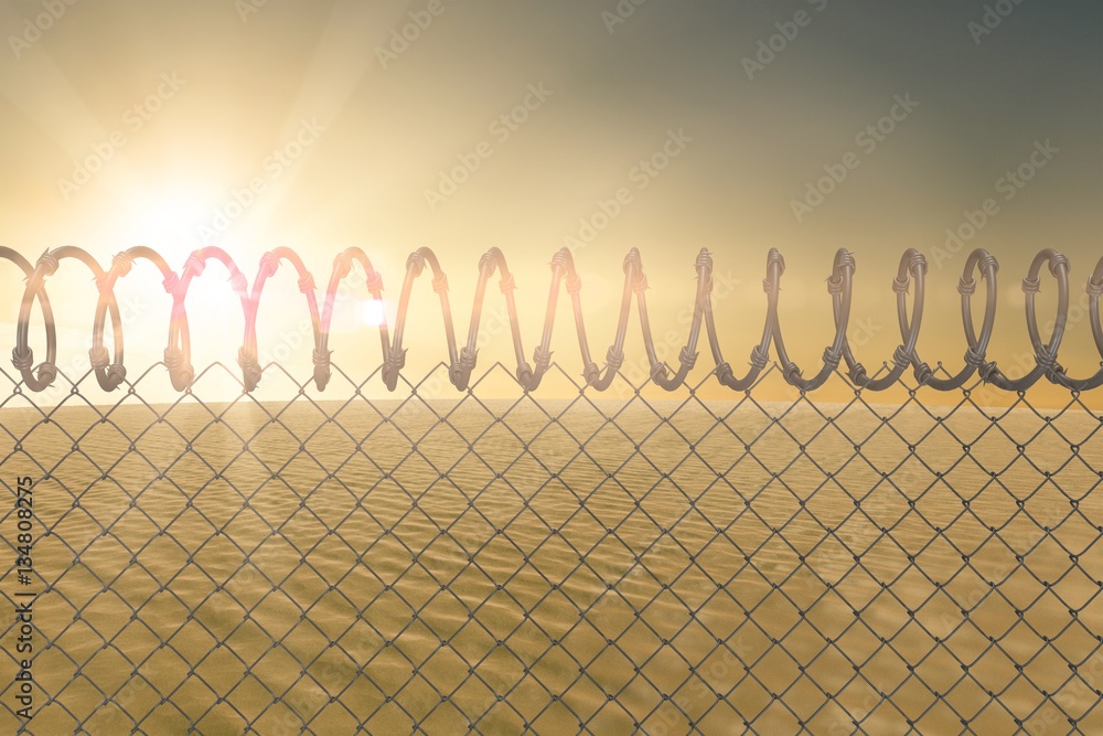 Composite image of barbed wire fence by white background