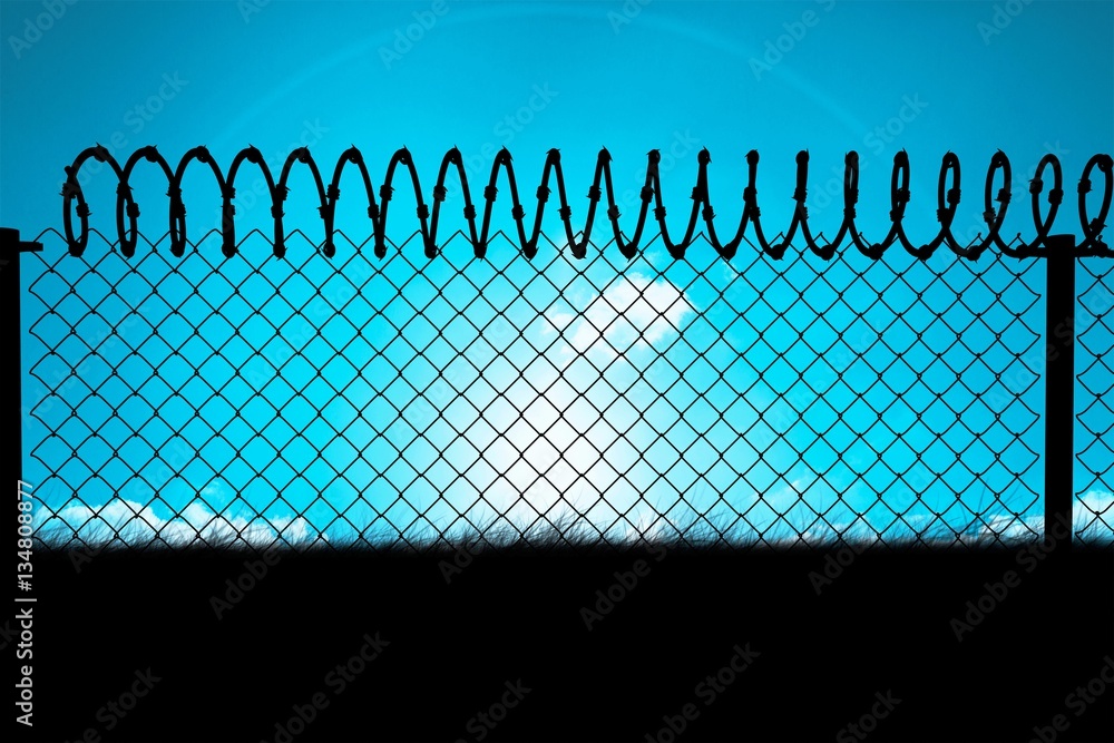 Composite image of chainlink fence against  white background