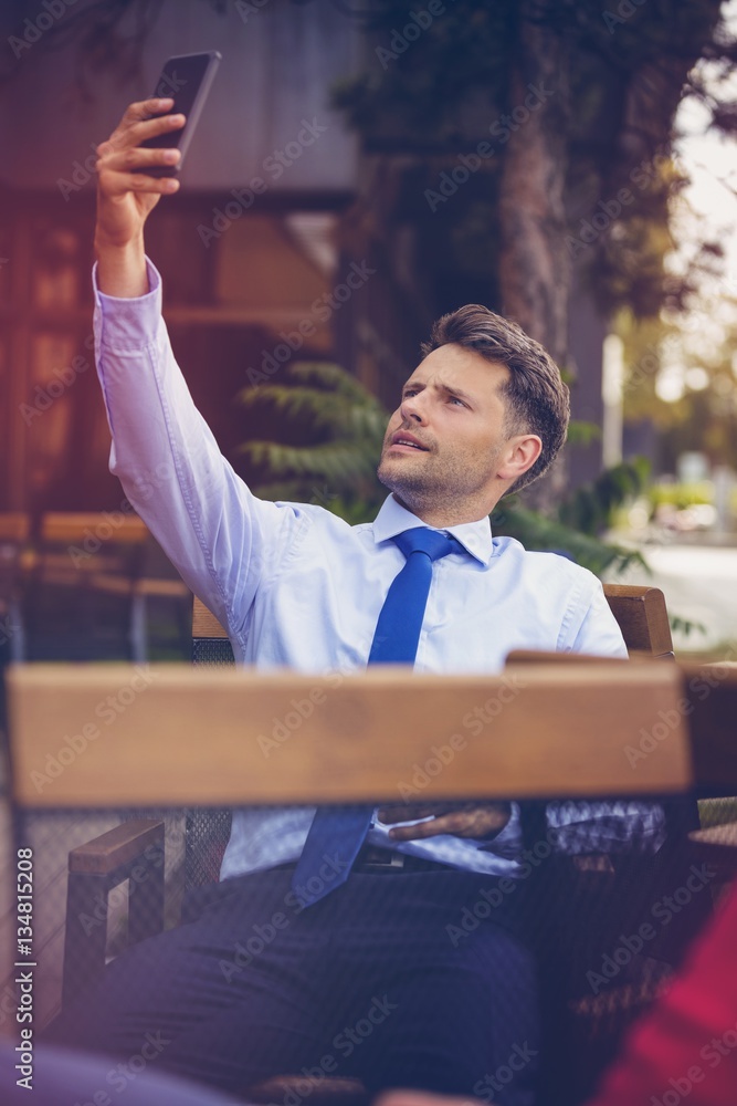 Businessman taking selfie