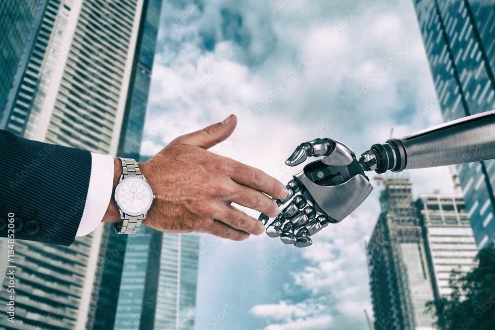 Composite image of businessman in suit clenching fists