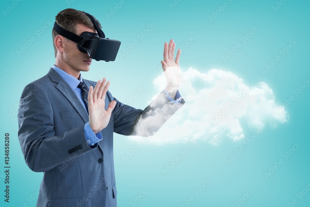 Composite image of businessman using virtual reality headset 3d