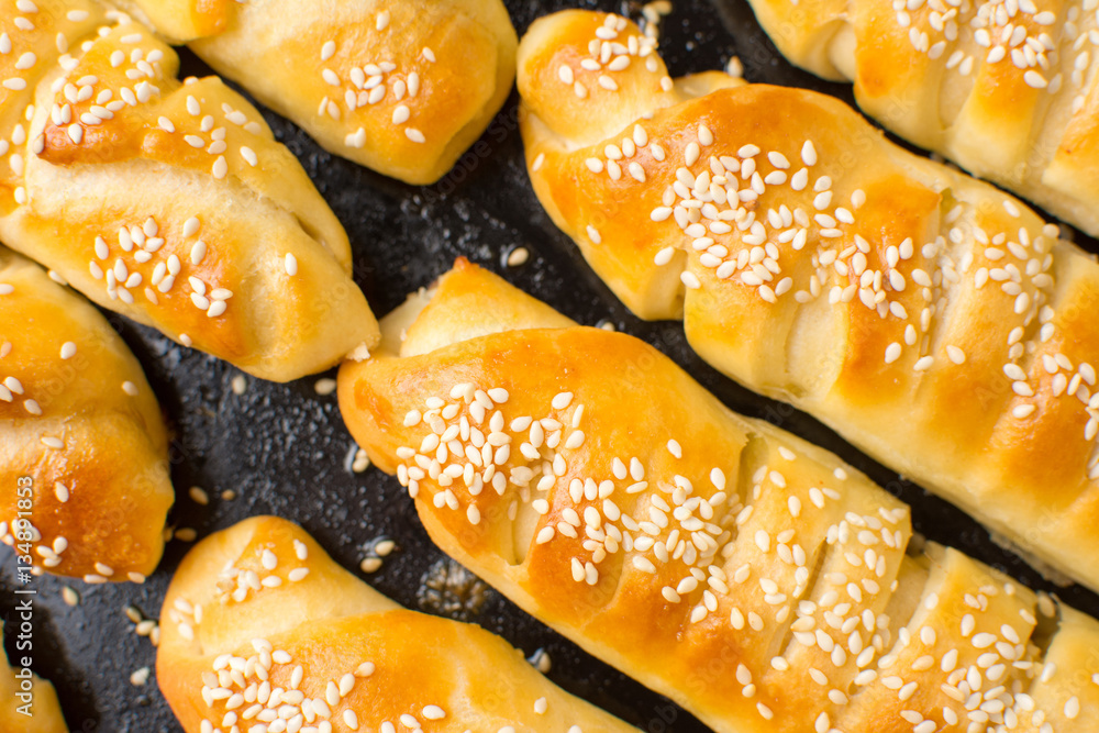 Homemade pastry on black baking pan