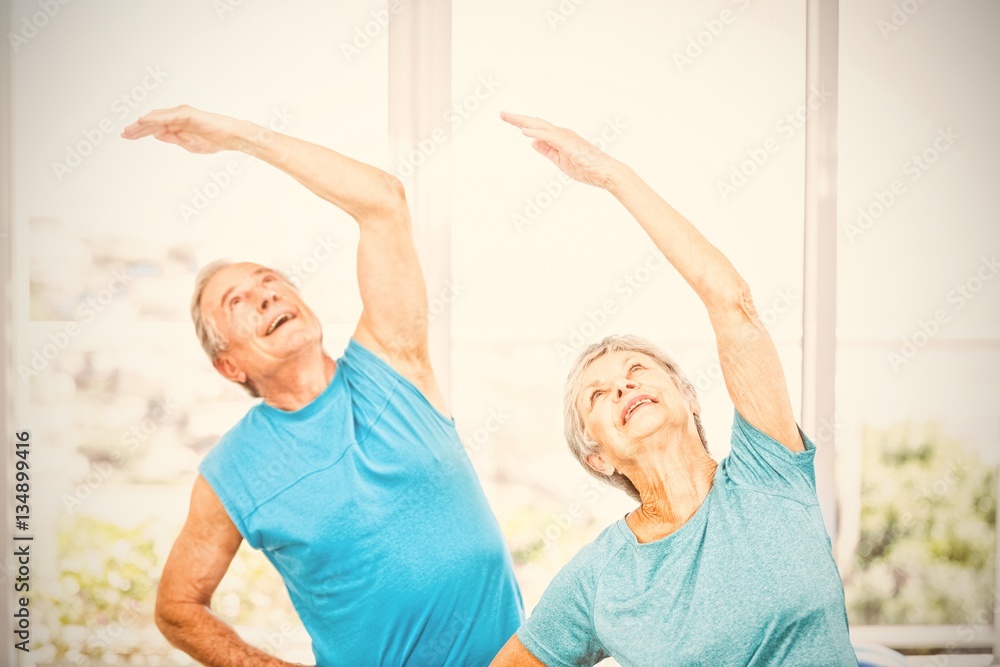 Senior couple looking up at home