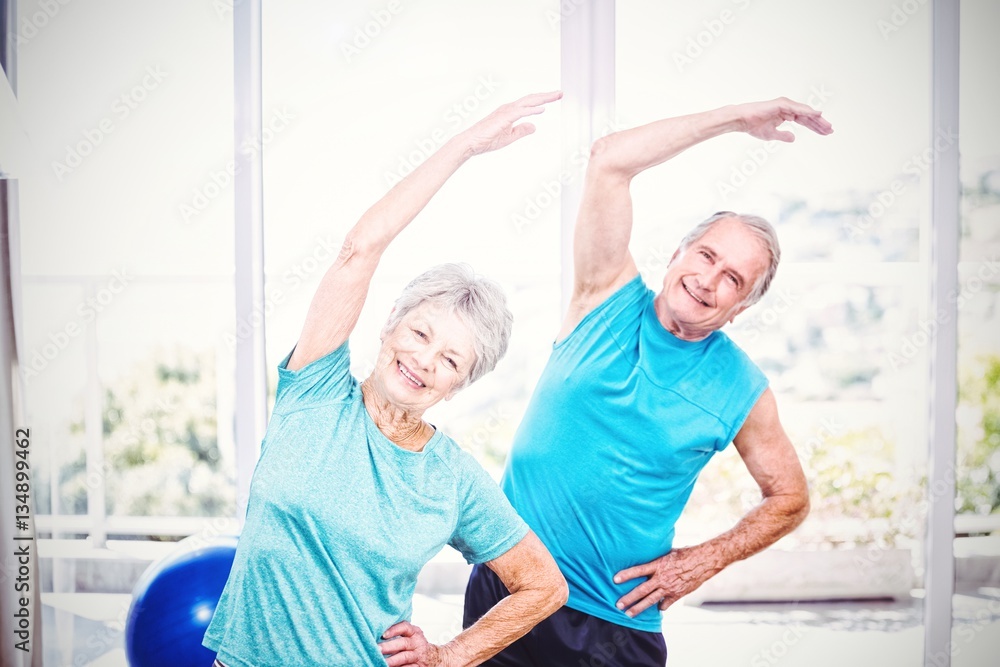 Portrait of senior couple exercising