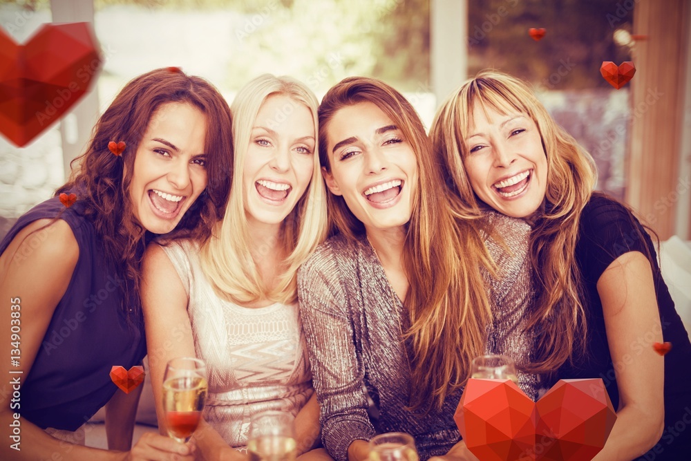 Composite image of portrait of beautiful women having drink