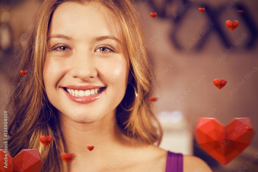 Composite image of portrait of smiling young woman