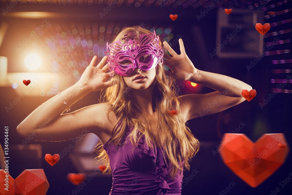 Composite image of woman with masquerade dancing on dance floor