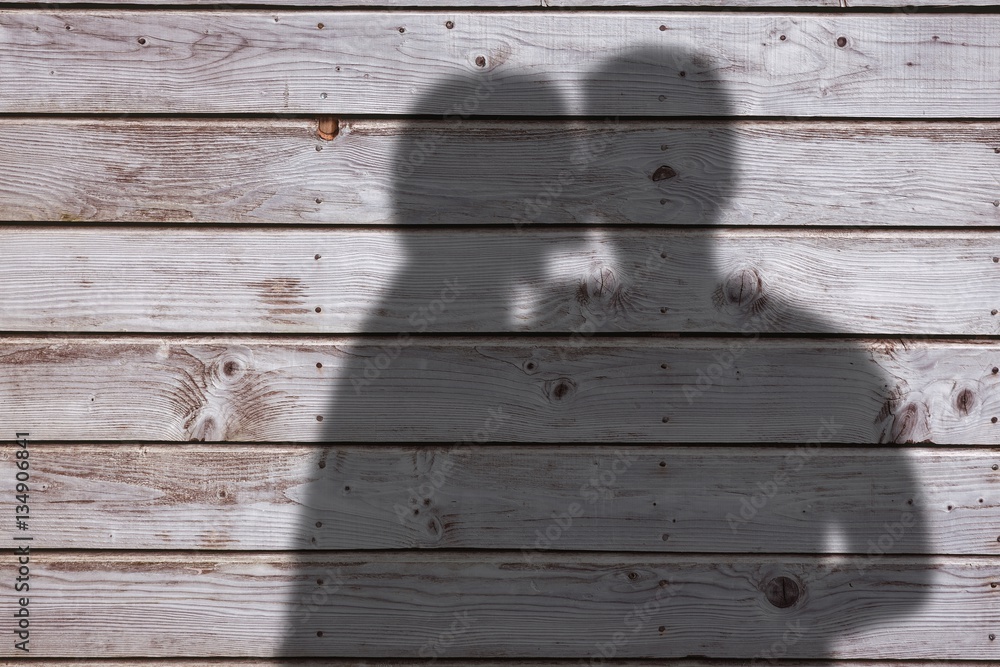 Composite image of woman kissing man on cheek