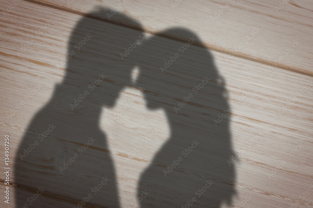 Composite image of happy young couple rubbing nose