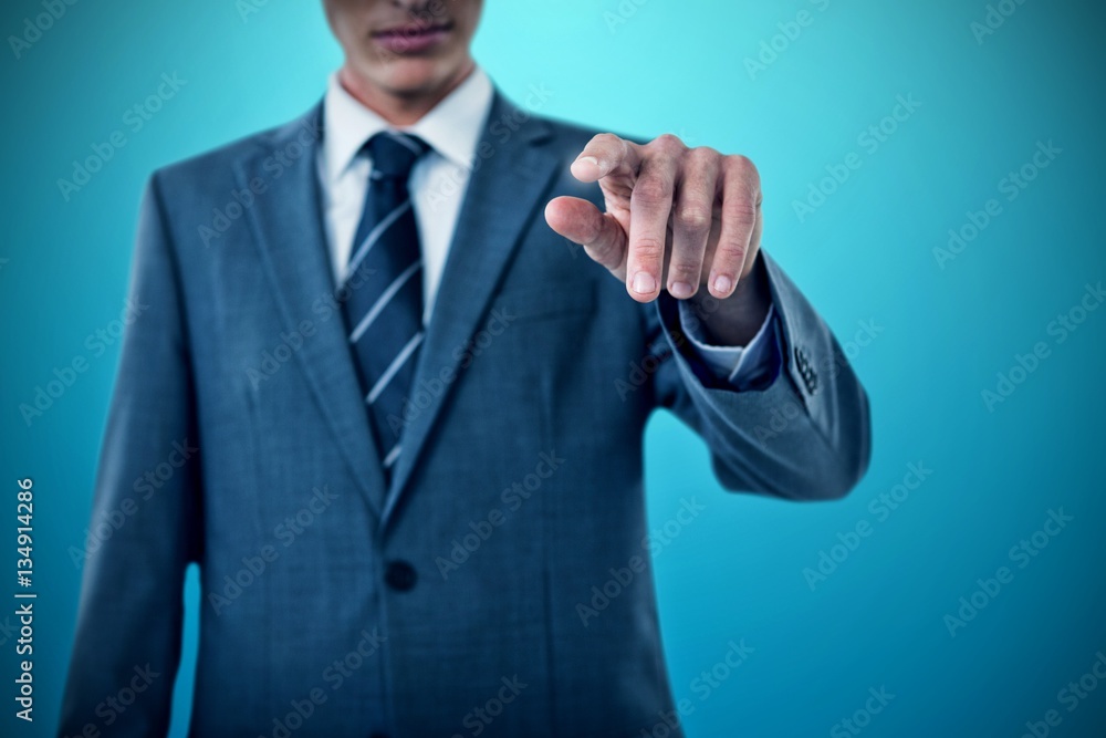 Composite image of midsection of businessman pointing